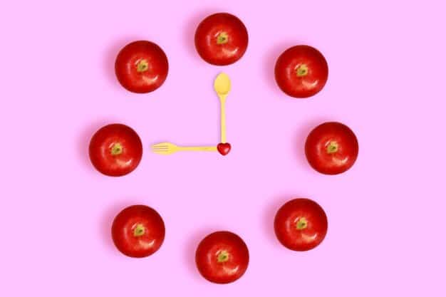 A visual representation of different time management techniques, such as the Pomodoro Technique, time blocking, and prioritization matrix, displayed on a digital tablet in a bright, modern office setting.