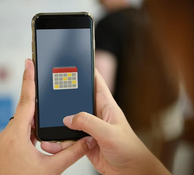 A close-up shot of a digital calendar app on a smartphone. The calendar is color-coded with different time blocks for various activities like meetings, work, exercise, and personal time.