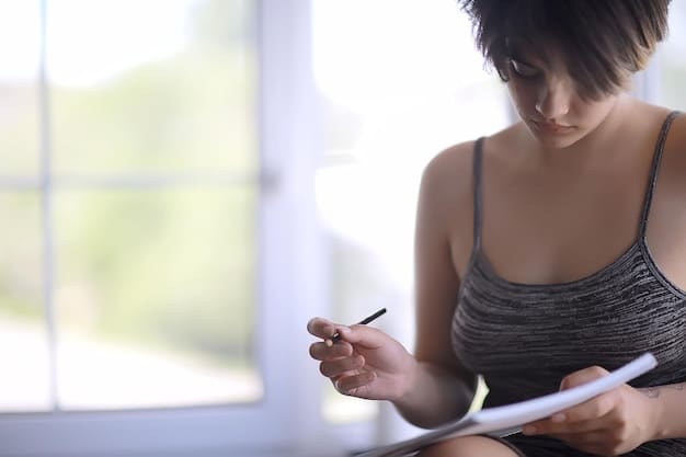 A person using a habit tracker app on their smartphone to monitor their habit stacking progress. The app displays a list of habits stacked together, with checkmarks indicating completed habits and progress charts tracking consistency.